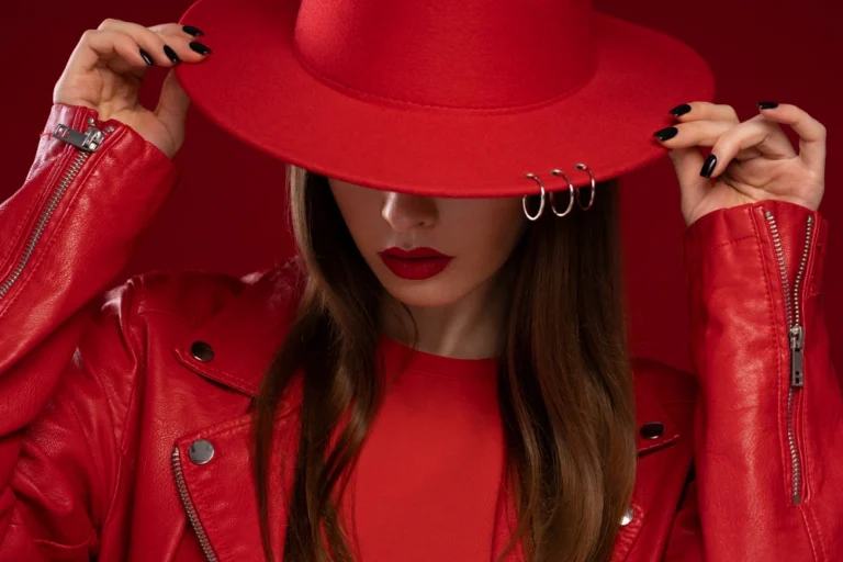 Fashion girl in red clothes and hat. It means that we work with the fashion and beauty industry.