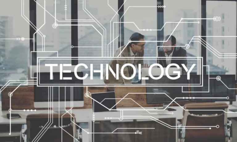 Two business people discussing IT and technology in a modern office with a digital overlay.