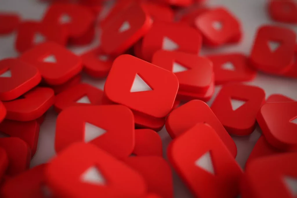 A pile of red YouTube logo icons, representing a vast and engaging platform for video advertising. That is, it is about YouTube ads.